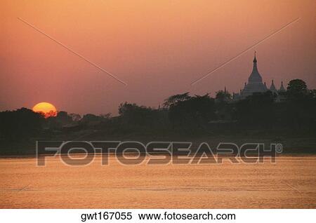 Sunset over a river, Ayeyarwady River, Sagaing, Myanmar View Large Photo Image Stock Photography - Sunset over a river, Ayeyarwady River, Sagaing, Myanmar. Fotosearch