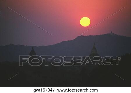 Stock Photo - Sunset over pagodas, Bagan, Myanmar. Fotosearch