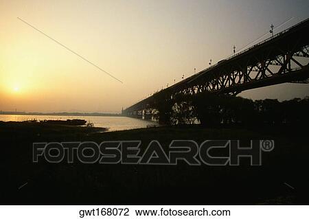 Bridge across a river, Yangtze River, Nanjing, China View Large Photo Image Stock Image - Bridge across a river, Yangtze River, Nanjing, China. Fotosearch