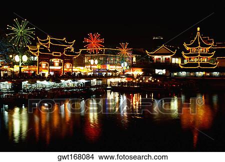 Buildings lit up at night, Nanjing, Jiangsu Province, China View Large Photo Image Picture - Buildings lit up at night, Nanjing, Jiangsu Province, China. Fotosearch