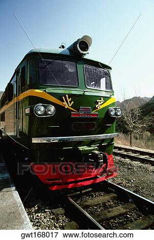 Passenger train on a railroad track, Beijing, China View Large Photo Image Stock Photo - Passenger train on a railroad track, Beijing, China. Fotosearch