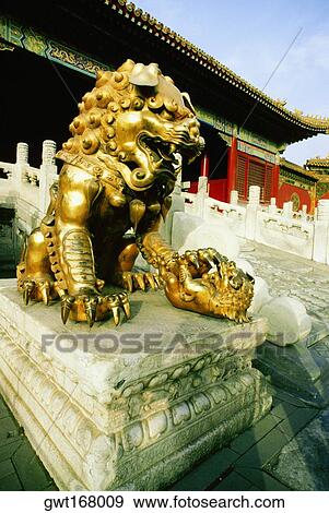 Statue of a lion in front of a building, Forbidden City, Beijing, China View Large Photo Image Stock Photo - Statue of a lion in front of a building, Forbidden City, Beijing, China. Fotosearch