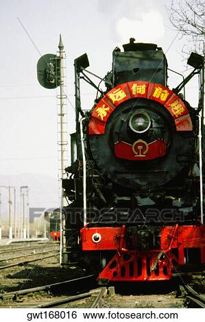 Steam train on a railroad track, Beijing, China View Large Photo Image Stock Photograph - Steam train on a railroad track, Beijing, China. Fotosearch