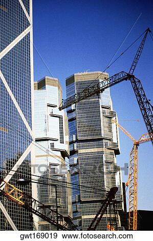 Cranes at a construction site, Hong Kong, China View Large Photo Image Stock Photo - Cranes at a construction site, Hong Kong, China. Fotosearch