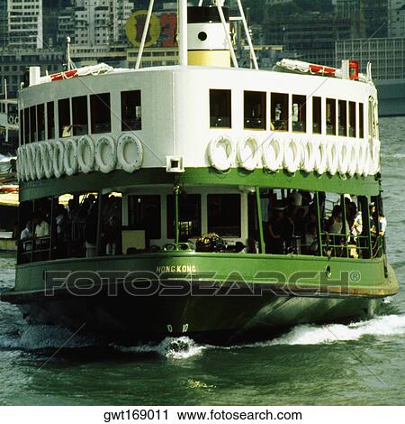 Stock Image - Ferry near a harbor, Victoria Harbor, Hong Kong, China. Fotosearch