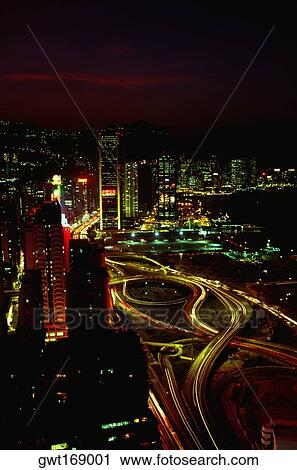 Stock Image - High angle view of buildings lit up at night, Causeway Bay, Hong Kong, China. Fotosearch