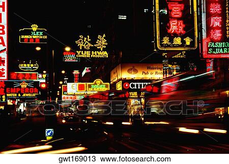 Stock Image - Neon signboards lit up at night, Kowloon, Hong Kong, China. Fotosearch