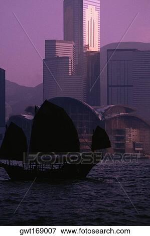 Silhouette of a junk ship in the sea, Victoria Harbor, Hong Kong, China View Large Photo Image Stock Photo - Silhouette of a junk ship in the sea, Victoria Harbor, Hong Kong, China. Fotosearch
