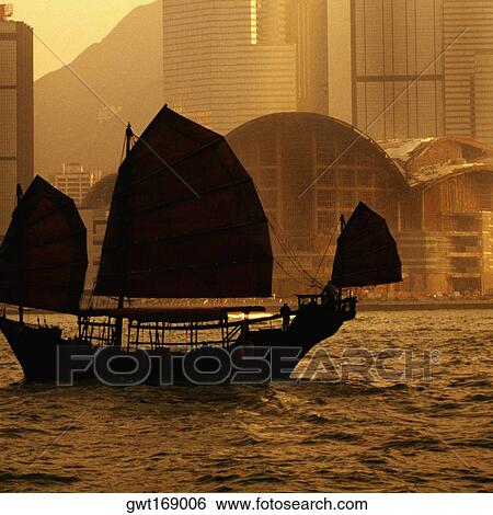 Silhouette of a junk ship in the sea, Victoria Harbor, Hong Kong, China View Large Photo Image Stock Photograph - Silhouette of a junk ship in the sea, Victoria Harbor, Hong Kong, China. Fotosearch