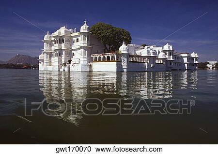 Reflection of a hotel in a lake, Lake Palace, Lake Pichola, Udaipur, Rajasthan, India View Large Photo Image Stock Image - Reflection of a hotel in a lake, Lake Palace, Lake Pichola, Udaipur, Rajasthan, India. Fotosearch