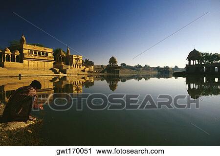 Reflection of a temple in a lake, Gadsisar Lake, Jaisalmer, Rajasthan, India View Large Photo Image Stock Image - Reflection of a temple in a lake, Gadsisar Lake, Jaisalmer, Rajasthan, India. Fotosearch