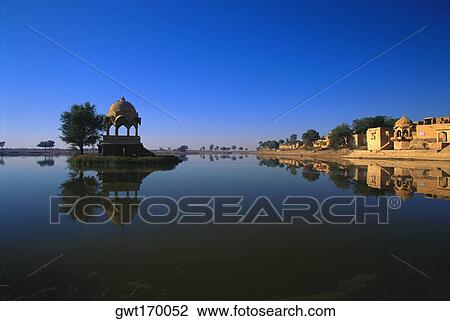 Reflection of a temple in a lake, Gadsisar Lake, Jaisalmer, Rajasthan, India View Large Photo Image Stock Image - Reflection of a temple in a lake, Gadsisar Lake, Jaisalmer, Rajasthan, India. Fotosearch