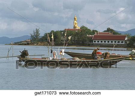 Fisherman standing on a fishing boat, Koh Samui, Thailand View Large Photo Image Stock Image - Fisherman standing on a fishing boat, Koh Samui, Thailand. Fotosearch