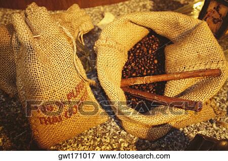 Stock Photo - High angle view of coffee beans in burlap sacks, Bangkok, Thailand. Fotosearch