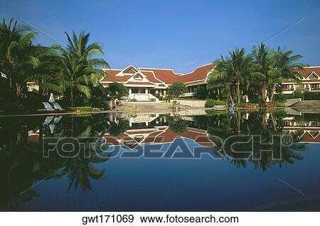 Stock Photo - Reflection of a resort in water, Koh samui, Thailand. Fotosearch