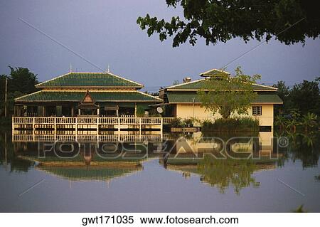 Reflection of inns in water, Sukhothai, Thailand View Large Photo Image Stock Photography - Reflection of inns in water, Sukhothai, Thailand. Fotosearch
