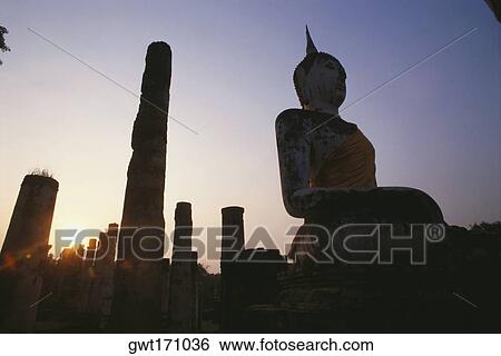 Silhouette of a statue of Buddha in a temple, Wat Mahathat, Sukhothai Historical Park, Sukhothai, Thailand View Large Photo Image Stock Photograph - Silhouette of a statue of Buddha in a temple, Wat Mahathat, Sukhothai Historical Park, Sukhothai, Thailand. Fotosearch