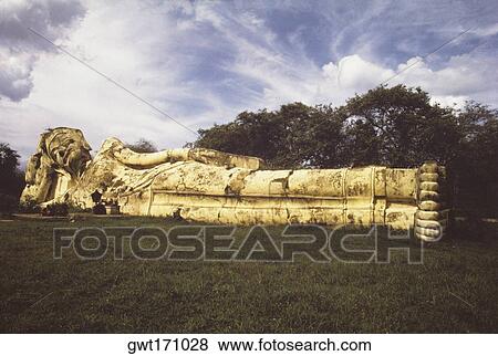 Statue of reclining Buddha in a garden, Ayudhaya, Thailand View Large Photo Image Stock Photo - Statue of reclining Buddha in a garden, Ayudhaya, Thailand. Fotosearch