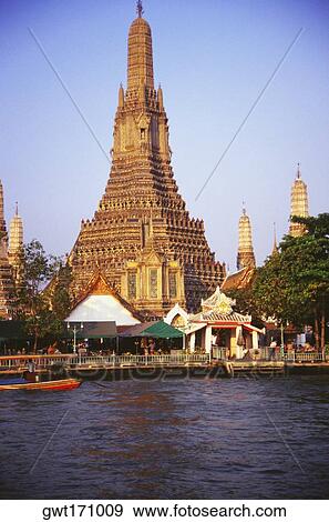 Temple on the bank of a river, Wat Arun, Bangkok, Thailand View Large Photo Image Stock Photo - Temple on the bank of a river, Wat Arun, Bangkok, Thailand. Fotosearch