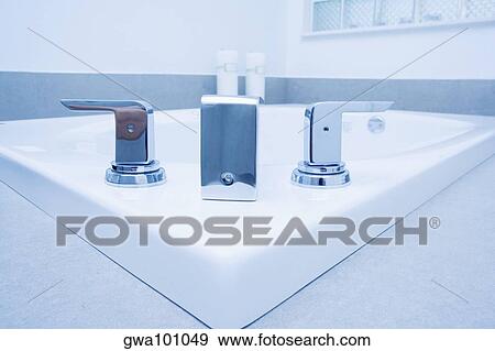 Close-up of a bathtub faucet View Large Photo Image Stock Photo - Close-up of a bathtub faucet. Fotosearch