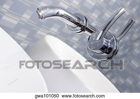 Close-up of a faucet in the bathroom View Large Photo Image Stock Image - Close-up of a faucet in the bathroom. Fotosearch