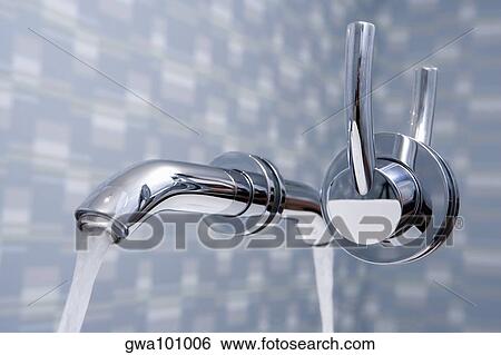 Stock Photograph - Close-up of a faucet in the bathroom. Fotosearch