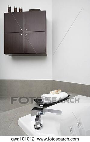 Stock Image - Towel near a bathtub. Fotosearch