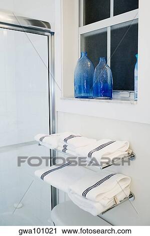 Towels on racks in the bathroom View Large Photo Image Stock Image - Towels on racks in the bathroom. Fotosearch