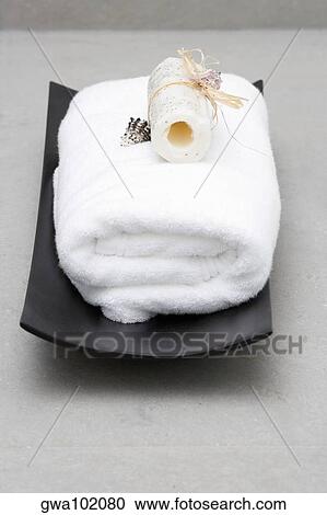 Stock Image - Close-up of a towel with a loofah. Fotosearch