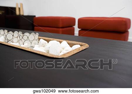 Stock Photo - Close-up of decorative glasses on pebbles. Fotosearch