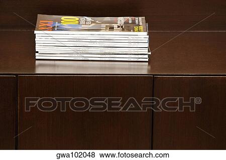 Stock Photo - Close-up of magazines on a table. Fotosearch