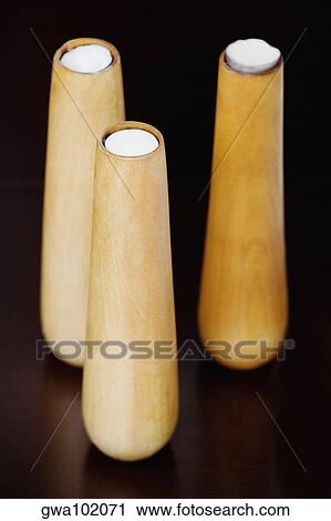 Stock Image - Close-up of three candlestick holders. Fotosearch