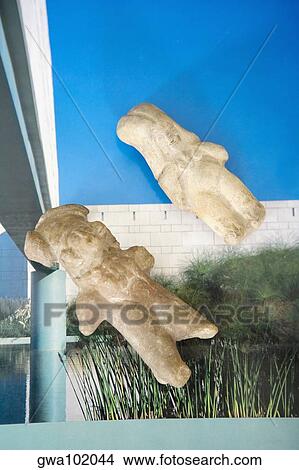 Picture - Close-up of two figurines on a magazine. Fotosearch
