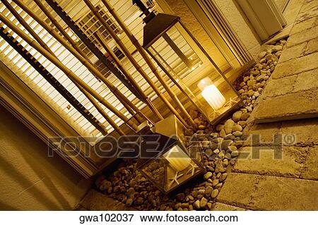 Stock Photo - Close-up of two lanterns in a living room. Fotosearch