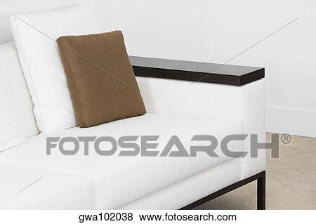 Stock Photo - Cushions on a couch in a living room. Fotosearch