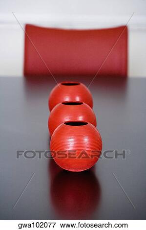 Decorative urns on a dining table in a dining room View Large Photo Image Stock Photo - Decorative urns on a dining table in a dining room. Fotosearch