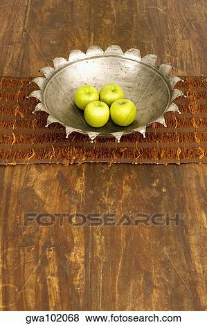 High angle view of four apples in a bowl at a dining table View Large Photo Image Stock Photo - High angle view of four apples in a bowl at a dining table. Fotosearch