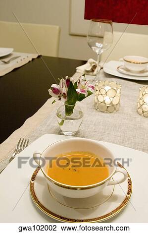 Stock Image - High angle view of soup in a bowl on a dining table. Fotosearch