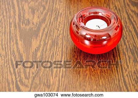 Close-up of a candle on a table View Large Photo Image Picture - Close-up of a candle on a table. Fotosearch