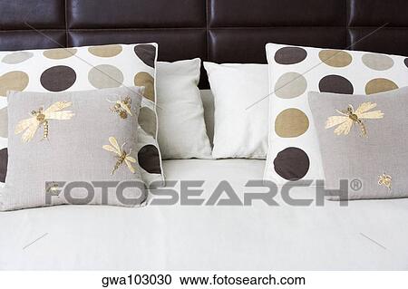 Close-up of cushions and pillows on the bed View Large Photo Image Stock Image - Close-up of cushions and pillows on the bed. Fotosearch