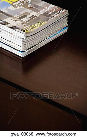 Close-up of magazines on a table View Large Photo Image Stock Photo - Close-up of magazines on a table. Fotosearch