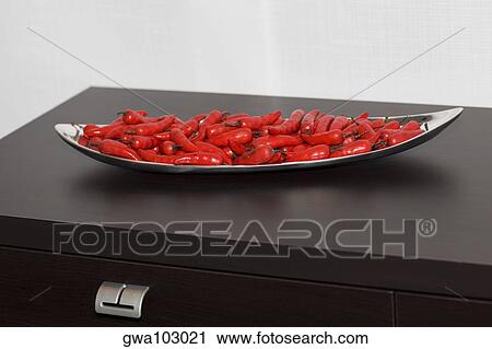 Close-up of red chili peppers in a tray View Large Photo Image Stock Image - Close-up of red chili peppers in a tray. Fotosearch