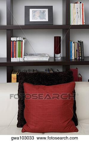 Couch in front of shelves in a living room View Large Photo Image Stock Image - Couch in front of shelves in a living room. Fotosearch