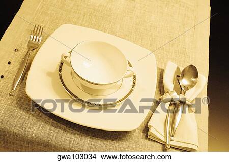 High angle view of a soup bowl with a plate on a dining table View Large Photo Image Picture - High angle view of a soup bowl with a plate on a dining table. Fotosearch