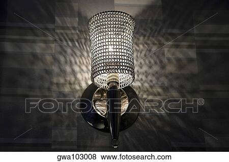 Stock Photo - Low angle view of a lamp lit up at night. Fotosearch