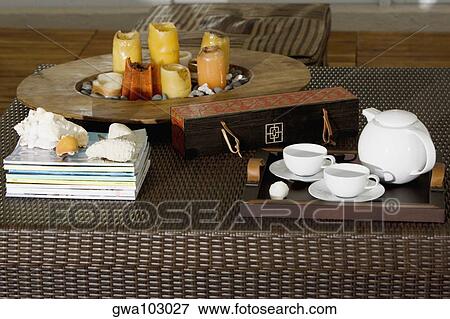 Stock Photo - Serving tray and candles on a table. Fotosearch