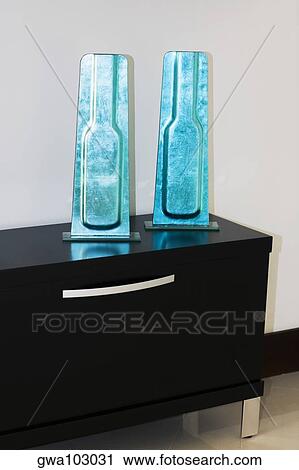 Two decorative forms on a chest View Large Photo Image Stock Image - Two decorative forms on a chest. Fotosearch