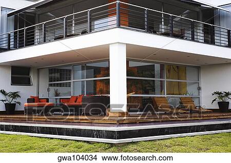 Couch and armchairs in a patio of a house View Large Photo Image Picture - Couch and armchairs in a patio of a house. Fotosearch