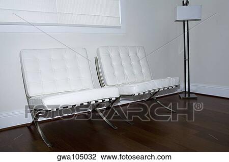 Floor lamp near chairs in a room View Large Photo Image Stock Image - Floor lamp near chairs in a room. Fotosearch