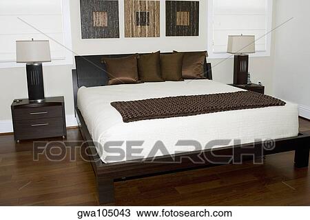 Stock Image - Interiors of a bedroom. Fotosearch